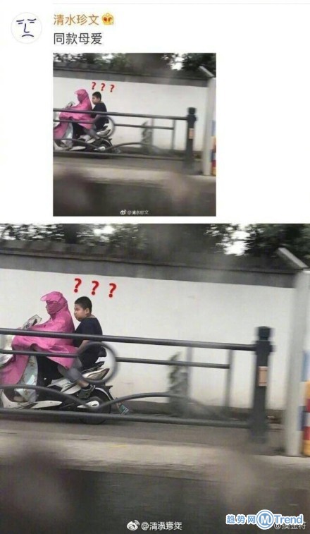 妈妈把孩子举起来挡雨 绝对是亲生的